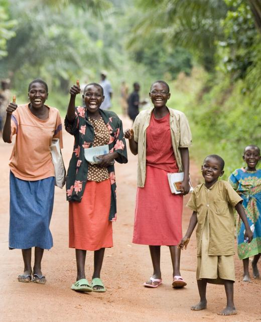 Joyful group walking down a rural path